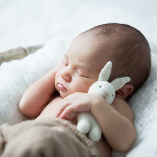 Sweet,Newborn,Baby,Sleeps,With,A,Toy,Hare,On,A